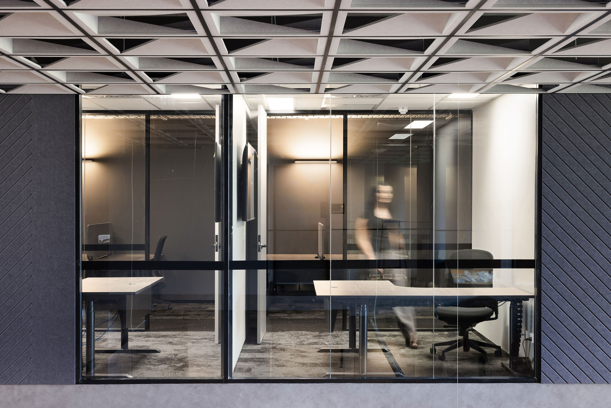 Infinity Group Australia's mezzanine office floor designed by Leithal Designs with enclosed executive offices, collaborative spaces, and custom Autex acoustic ceiling panels in Southport.
