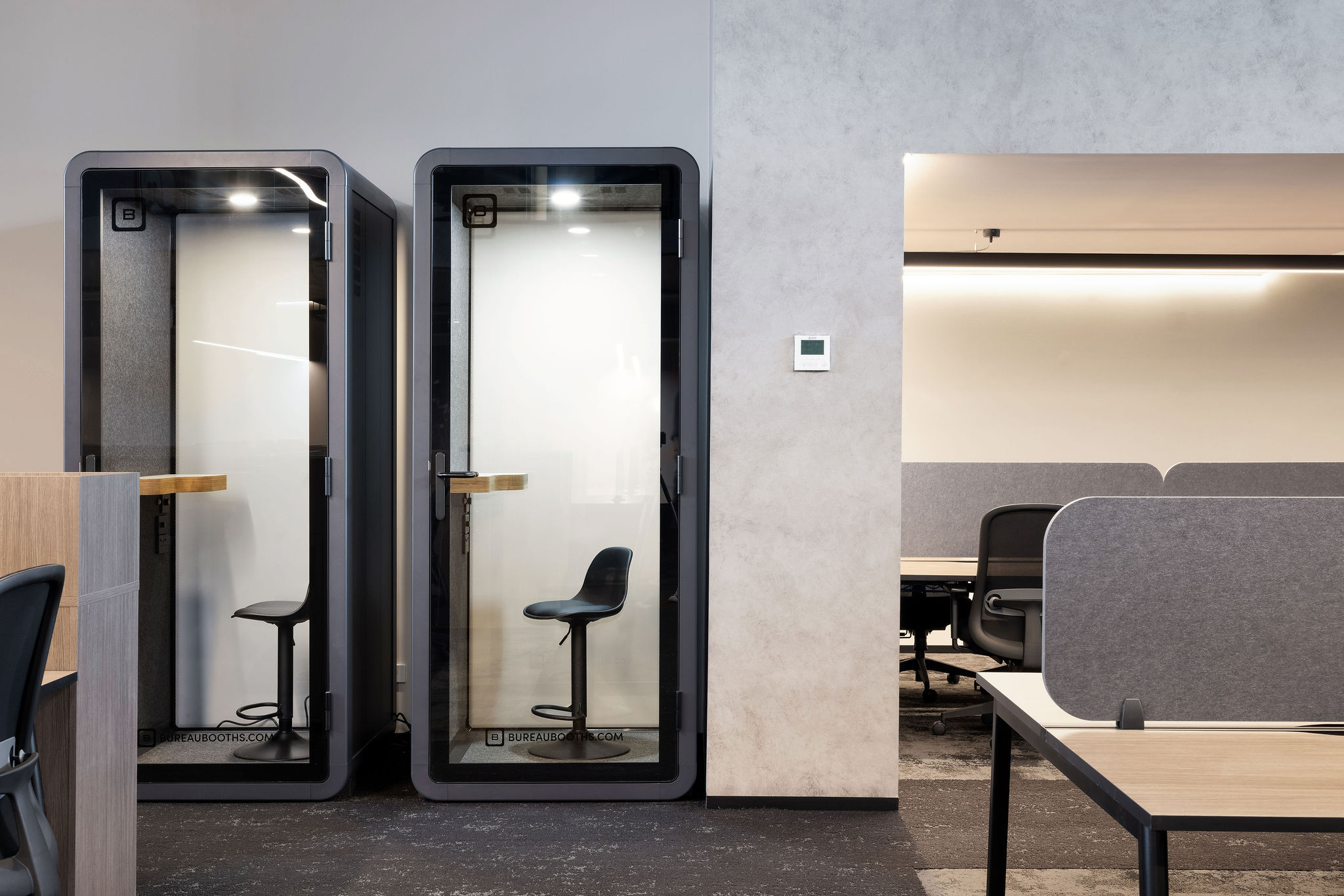Soundproof phone booths with acoustic treatments and bespoke joinery designed by Leithal Designs for Infinity Group Australia’s Southport office fitout.