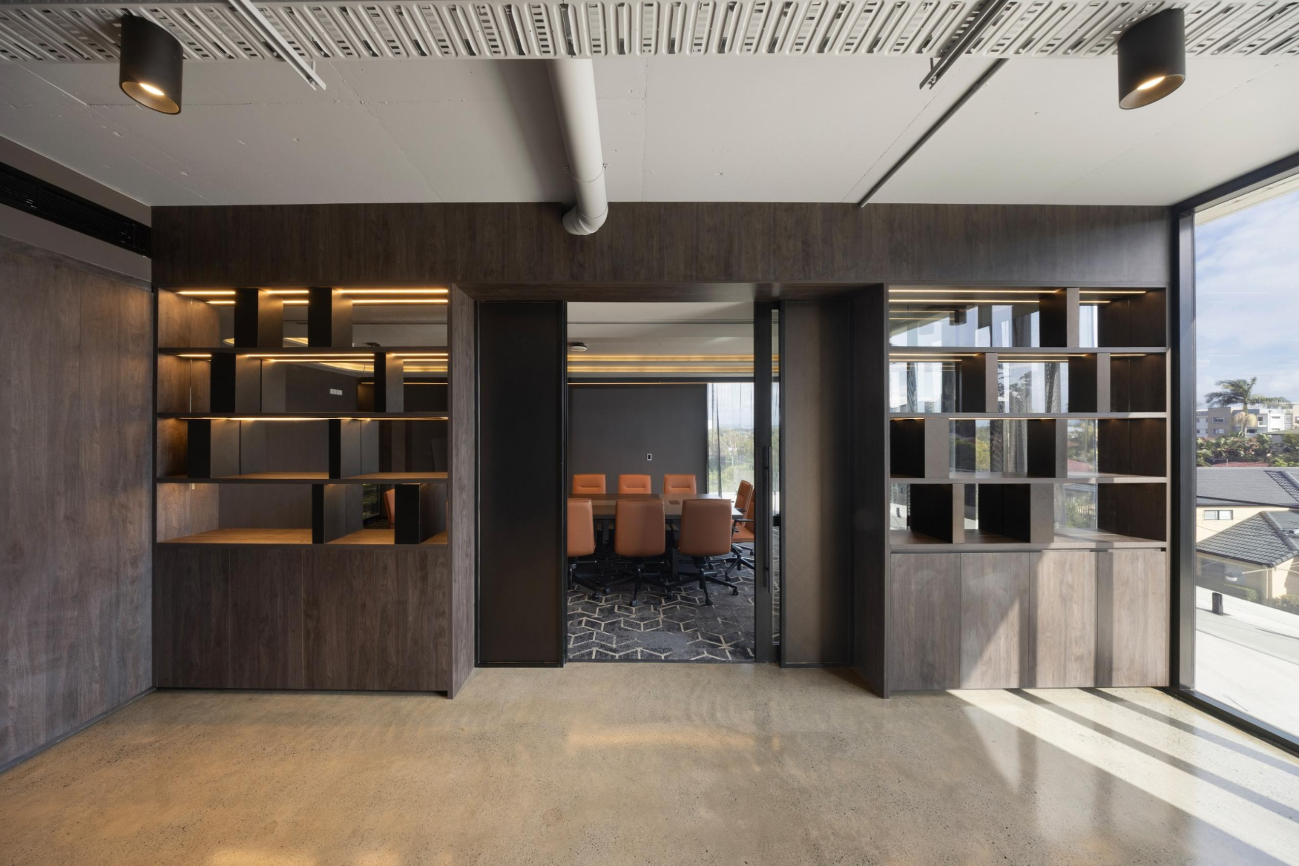 Executive foyer on Level 3 of Infinity Group Australia’s Southport office, with custom awards display and premium finishes designed by Leithal Designs to elevate the client experience.