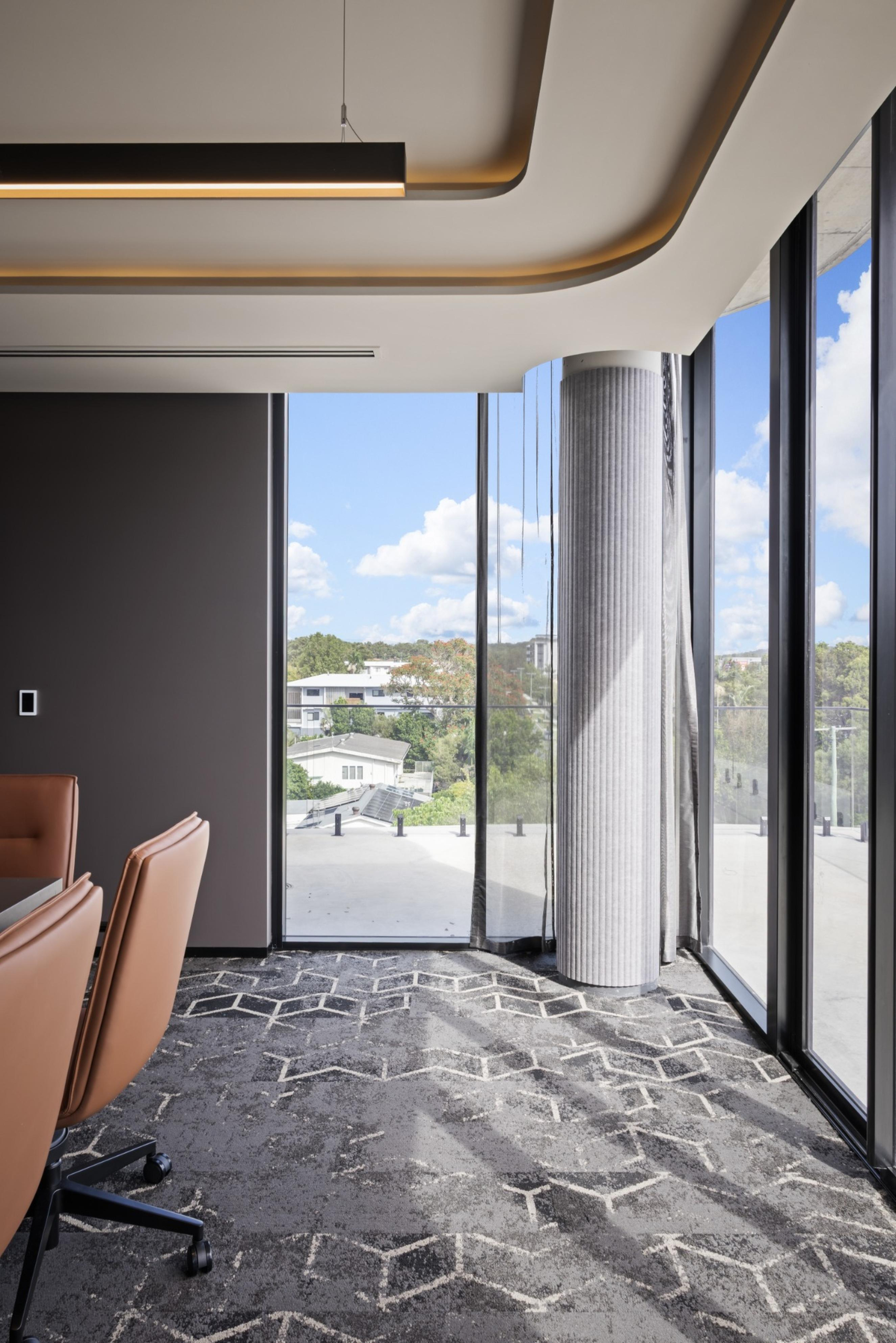 Infinity Group Australia’s Southport boardroom by Leithal Designs, seating 15 executives with bespoke joinery, advanced AV integration, and a refined interior palette.