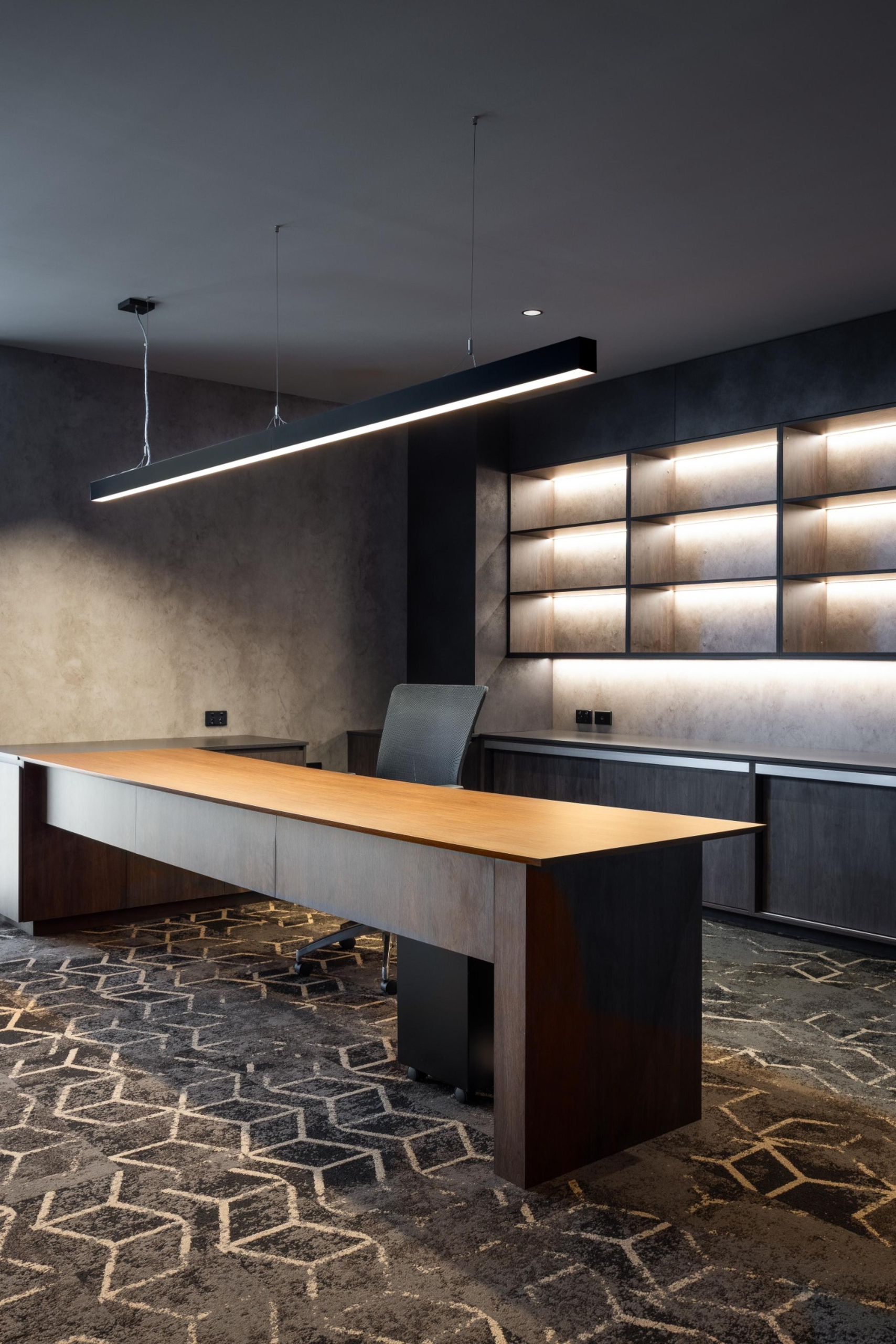 High-end executive office and workstation area at Infinity Group Australia's Southport headquarters, featuring custom joinery and LPA Lighting solutions by Leithal Designs.
