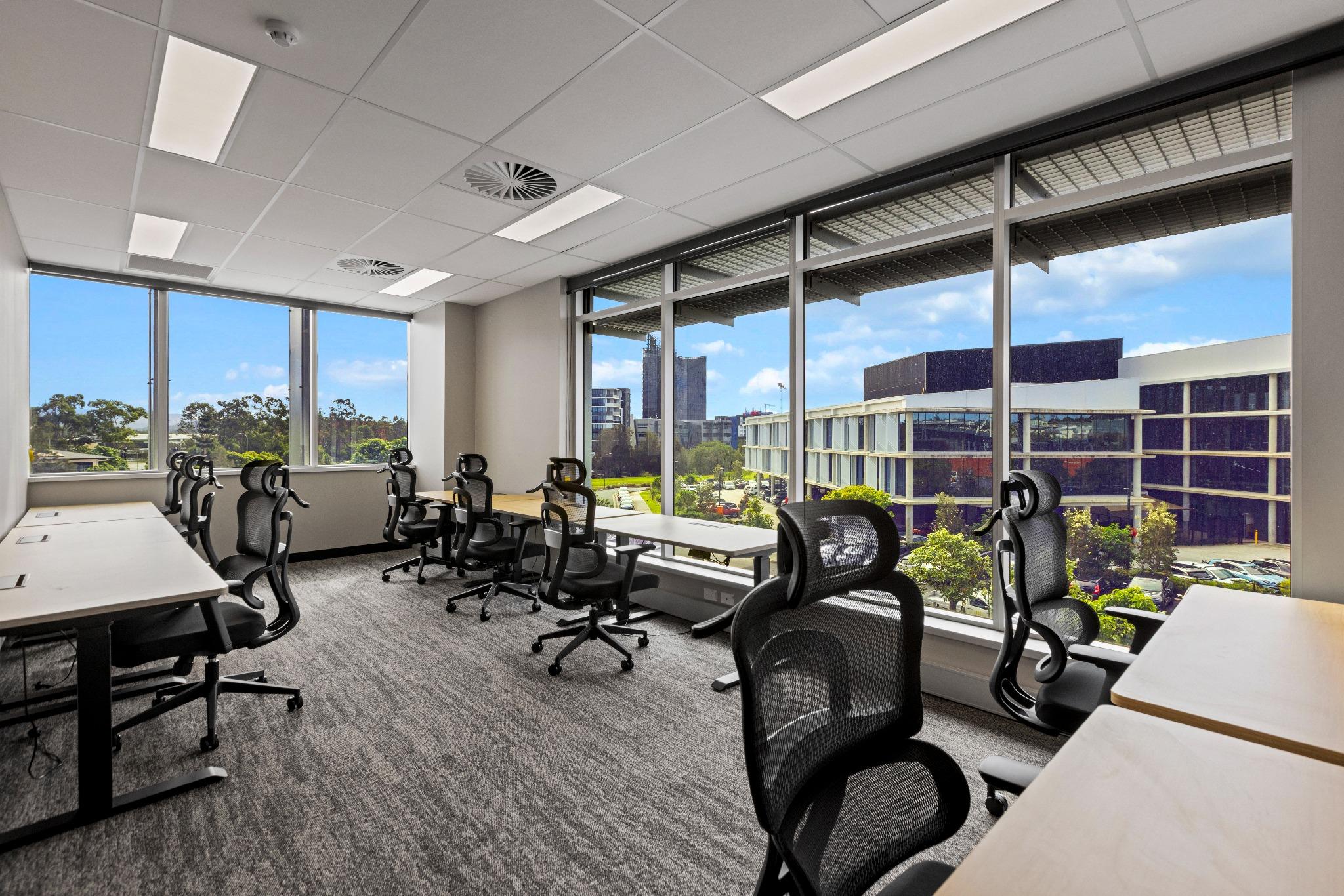 Team office suite with workstation seating for eight – flexible office design in Robina coworking space