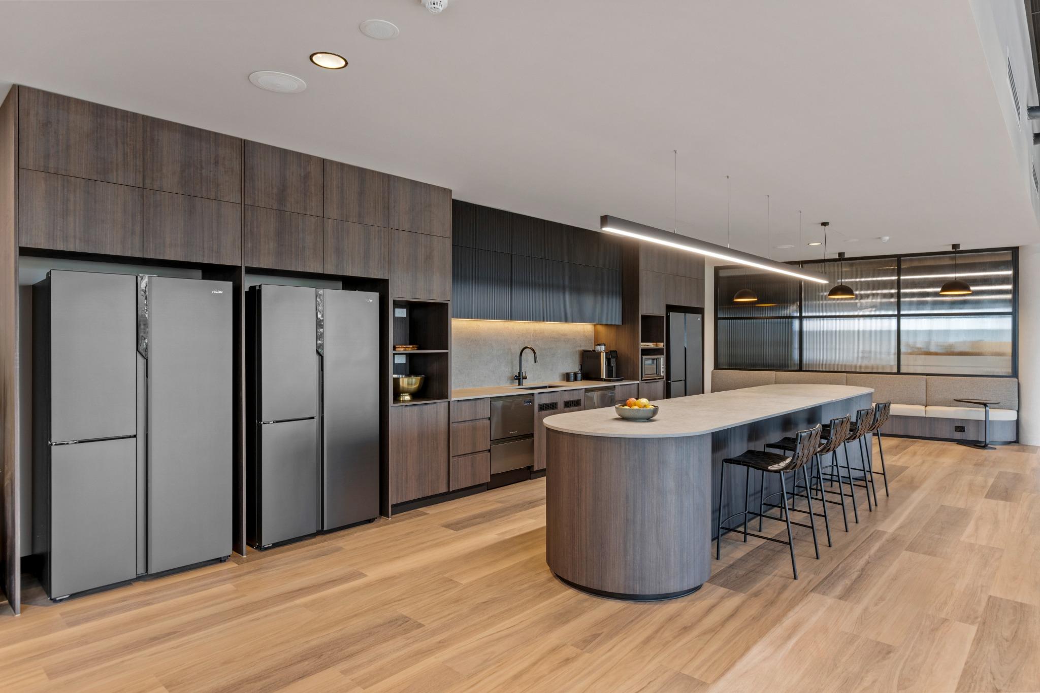Corporate office kitchenette with timber cabinetry – commercial interior design Robina Gold Coast