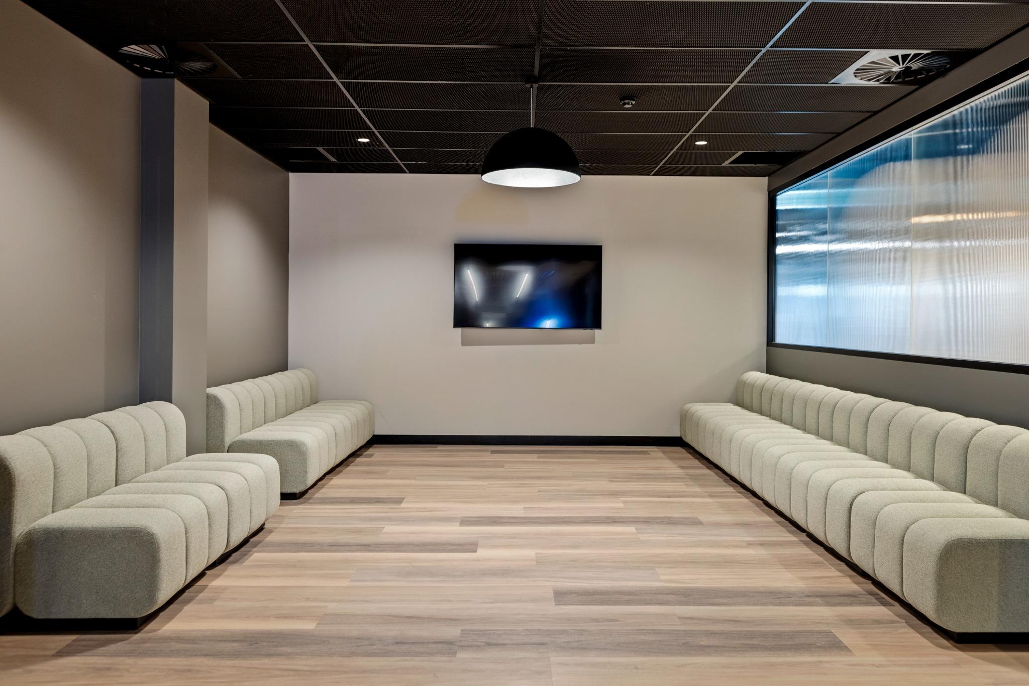 Breakout lounge at Riva Robina – Gold Coast office interior design with integrated AV