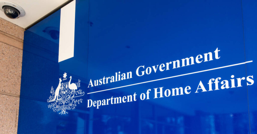 Australian Government sign for the Department of Home Affairs, featuring the national emblem and security camera, reflecting workspace refurbishment context.